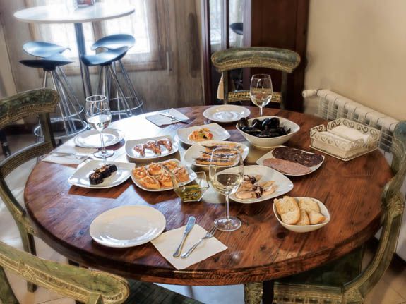 food and dining in spain we ate at a beautiful wood and iron table