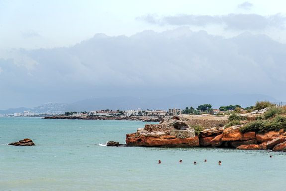 spanish coast Men chewing the fat in the sea near Vinaros