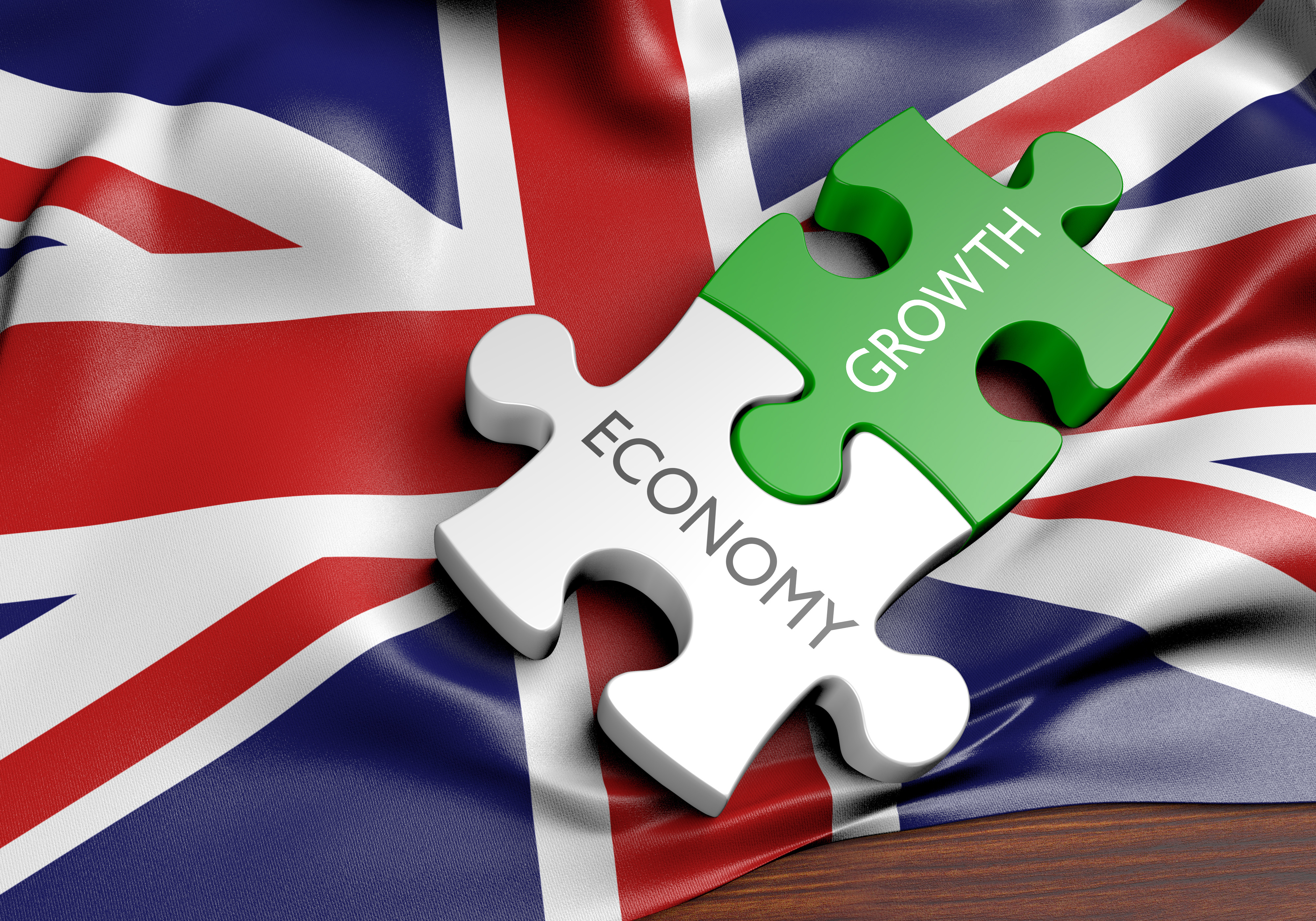 UK flag with two jigsaw pieces with words economy and growth
