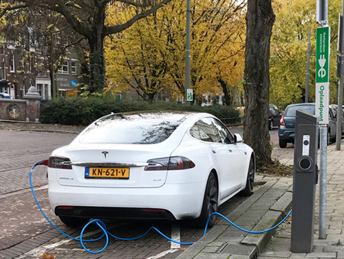 Tesla car being charged in Rotterdam